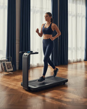 Woman using a walking pad in a bright UK living room for home fitness