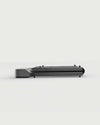 WalkingPad Z1 foldable walking treadmill folded for storage under a sofa