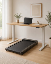 Walking pad under a standing desk in a calm UK home office