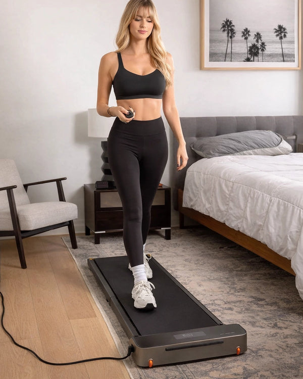 WalkingPad Z1 foldable walking treadmill in use in a bedroom for compact home walking workouts